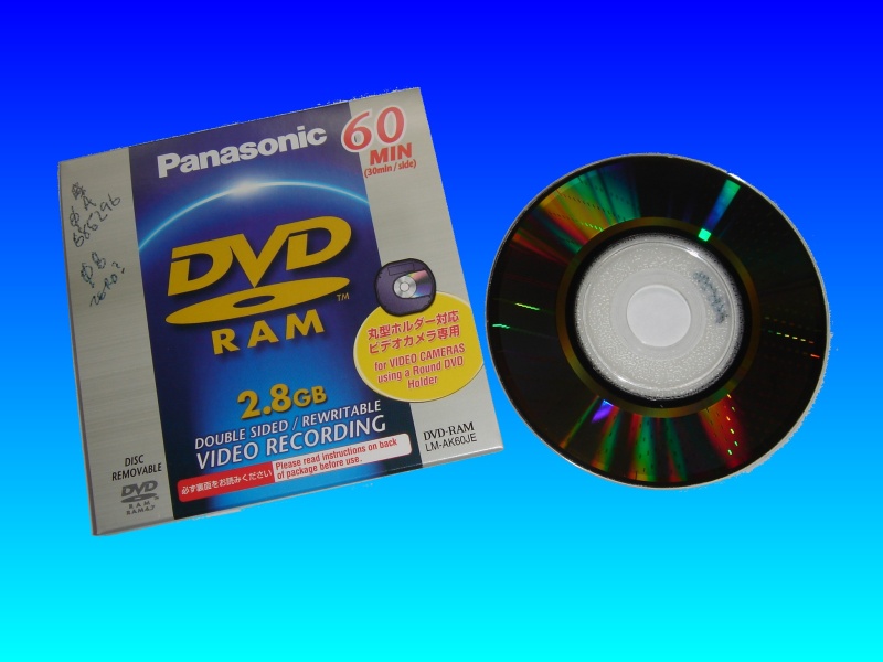 A Panasonic DVD-RAM cartridge used in Hitachi or Panasonic Video Cameras. The camcorder would record video directly to the disc. The disk surface where video was burnt can easily be seen as a darker area extending from the centre to the outer edge.
