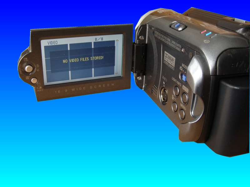 A JVC GZ-MG37U hard drive camcorder with the lcd display screen showing HDD error message. In this case the camera reports that no video files stored, and usually this is associated with hdd error as well. 