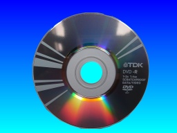 This TDK mini DVD disc was used in a Panasonic camcorder. The disc was full of video but un-finalized so would not playback on other DVD recorders. It is shown diffracting the light off its reflective surface.